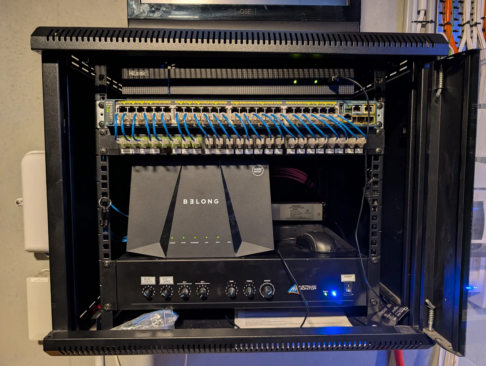 The same cabinet after the clean-up, with patch panels and dressed cabling